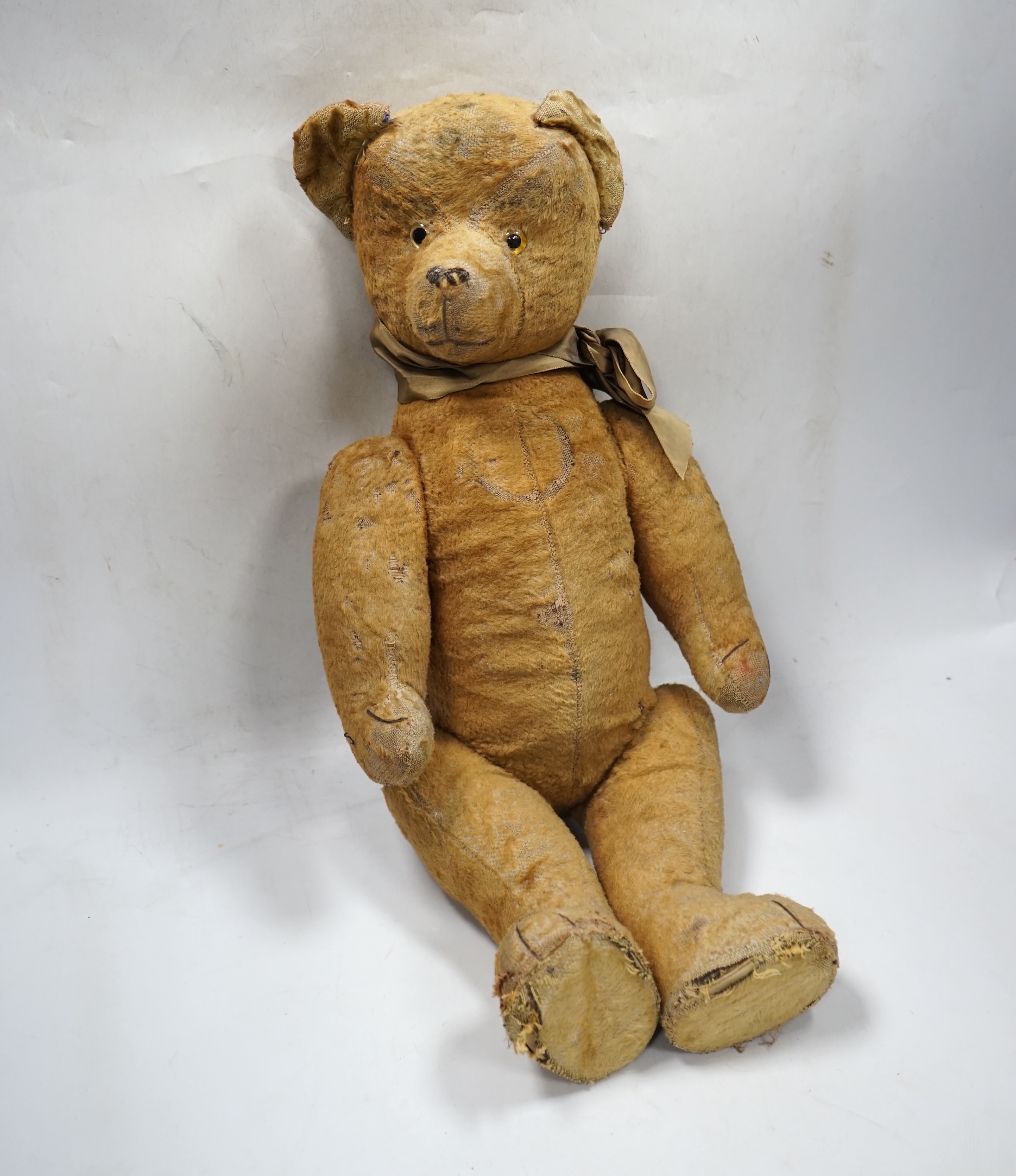 A 1930’s jointed Teddy bear, 53cm. Condition - poor